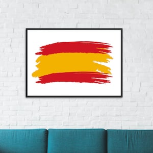 May include: A framed print of the Spanish flag, painted in a brushstroke style with red and yellow colors. The print is hanging on a white brick wall above a teal blue couch.