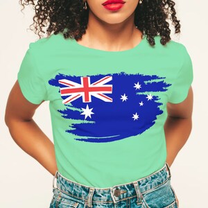 May include: A light green t-shirt with a distressed, blue and white Australian flag design.