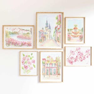 May include: A set of six framed watercolor paintings featuring pink flowers, a cityscape, and a church. The paintings are all in a light, airy style and would look great in a modern or traditional home.
