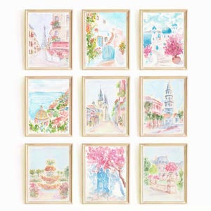 May include: Nine watercolor paintings in light pink, blue, and green hues, framed in light wood, depicting various European cityscapes.