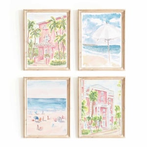 Pode incluir: Conjunto de quatro aquarelas em tons rosa claro e azul. Cada pintura é emoldurada em uma moldura de madeira clara. As pinturas representam um edifício rosa com palmeiras, uma cena de praia com um guarda-sol, uma cena de praia com pessoas e um edifício rosa com palmeiras.