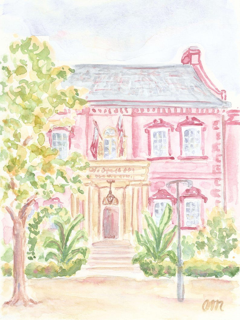 May include: A watercolor painting of a pink house with a white roof and a porch. The house has two windows on each side of the porch and a door in the center. There are green bushes and trees in front of the house.