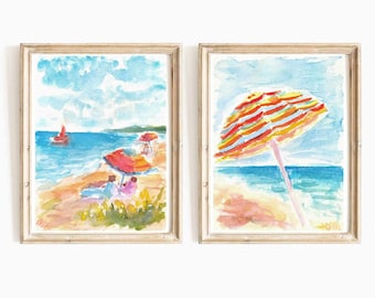 May include: Two watercolor paintings of a beach scene. The first painting shows a beach with people under red and white striped umbrellas. The second painting shows a beach with a single red and yellow striped umbrella.