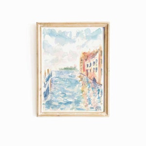 May include: A watercolor painting of a canal scene with a building on the right side of the canal. The building is painted in shades of pink, orange, and yellow. The canal is painted in shades of blue and green. The sky is painted in shades of blue and white.