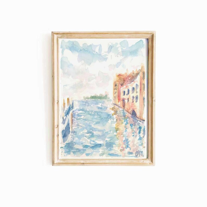 May include: A watercolor painting of a canal scene with a building on the right side of the canal. The building is painted in shades of pink, orange, and yellow. The canal is painted in shades of blue and green. The sky is painted in shades of blue and white.