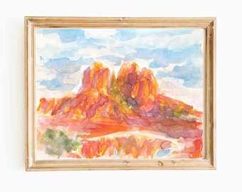 Peut inclure: Une peinture à l'aquarelle d'une formation rocheuse rouge avec un ciel bleu et des nuages blancs en arrière-plan. La peinture est encadrée dans un cadre en bois clair.