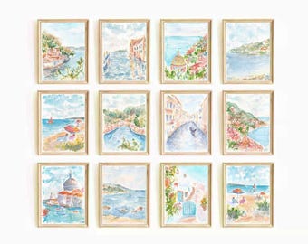 May include: A set of 12 watercolor paintings depicting various scenes of a coastal town. The paintings feature buildings, boats, water, and sky in shades of blue, green, pink, and yellow.