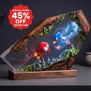 May include: A decorative resin and wood display featuring Sonic the Hedgehog and Knuckles the Echidna figures suspended within a clear resin block. The scene includes green mossy textures and wisps of blue and red smoke. Text reads: SPECIAL OFFER! 45% OFF LIMITED TIME.