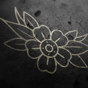May include: A detailed illustration of a flower with leaves, rendered in a vintage tattoo style. The design is in a light beige color, set against a dark, cracked, textured background. The artwork evokes a classic, timeless aesthetic.