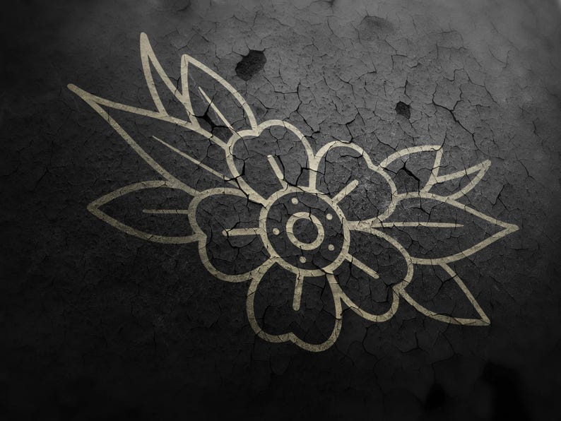 May include: A detailed illustration of a flower with leaves, rendered in a vintage tattoo style. The design is in a light beige color, set against a dark, cracked, textured background. The artwork evokes a classic, timeless aesthetic.