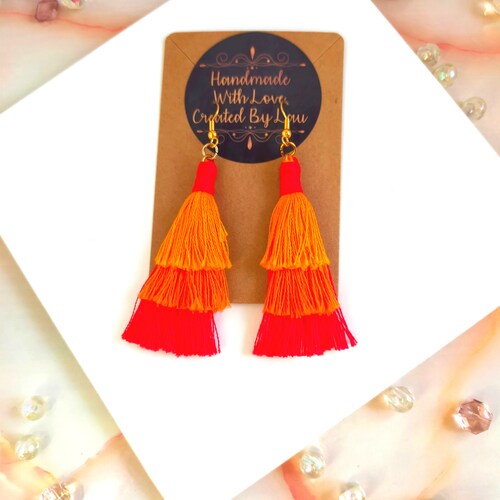Tiered cotton macramé tassel earrings, Handmade in shops UK, Gold plated orange and red boho jewellery, Statement drop earrings with fringe