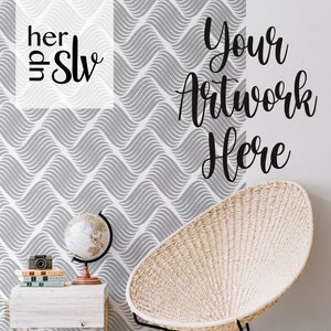 May include: A white wicker chair with black metal legs sits in front of a wall with a gray and white wavy pattern. The wall has the text "Your Artwork Here" written on it.