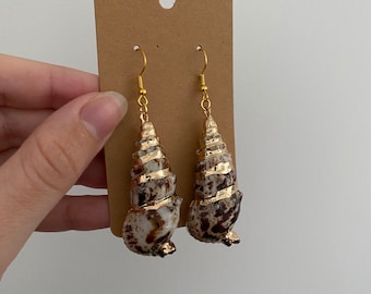 Gold shell dangle earrings