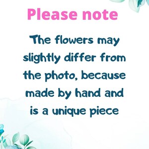 May include: White background with floral watercolor accents in blue, teal, and cream. Text in pink and teal states, "Please note: The flowers may slightly differ from the photo, because made by hand and is a unique piece."
