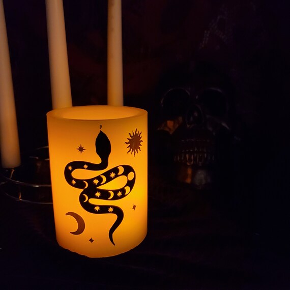 Serpent flickering candle
