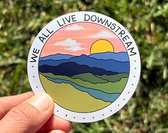 We All Live Downstream Mountain River Nature Scene - Vinyl Circle Bumper Water Bottle Sticker