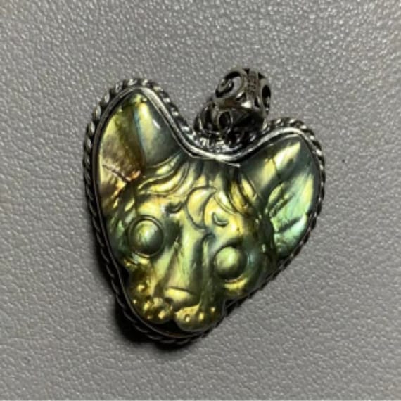 Carved Labradorite Animal Pendants Carved Labradorite Animal Pendants