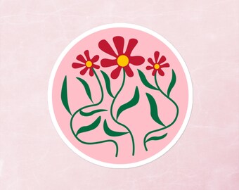 May include: A pink circle sticker with a white outline features a stylized illustration of three red flowers with yellow centers and green stems and leaves.