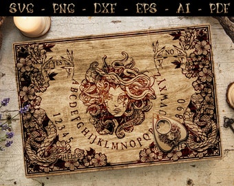 May include: A wooden Ouija board with a Gorgon Medusa design in the center. The board has the letters of the alphabet, numbers 1-9, and the words "yes", "no", and "goodbye".