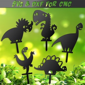 May include: Black metal dinosaur garden stakes in various shapes, including a Triceratops, T-Rex, and Stegosaurus. The stakes have a T-shaped base for easy placement in soil. The text "SVG & DXF FOR CNC" is at the top.