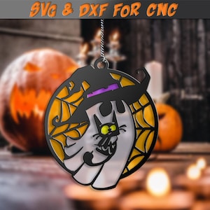 May include: Black and white Halloween ornament featuring a cat wearing a witch's hat and a spiderweb design. The ornament is round and has a hole at the top for hanging.
