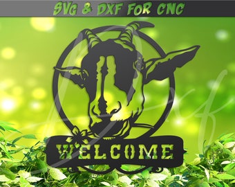 May include: Black metal silhouette of a goat's head with horns, inside a circle, with a banner below that says "WELCOME". The image is set against a green blurred background.
