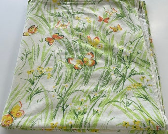 Vintage 1970s flannel bed sheet, orange, yellow butterflies in green grass, Sears made in Hong Kong bedsheet, twin size flannel top sheet