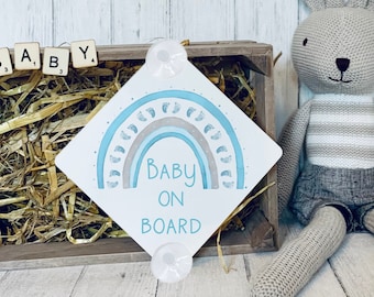 Baby on board sign. Blue baby footprint rainbow. Aluminium window sign with suction cups to adhere to the window.