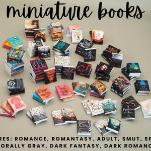 May include: A collection of miniature books with various colorful covers, arranged on a neutral surface. The text "miniature books" is at the top. Genres include romance, dark fantasy, and more.