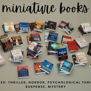 May include: A collection of miniature books with various covers, including titles by Stephen King. The image features the text "miniature books" and lists genres such as thriller, horror, and mystery. The books are arranged on a neutral surface.
