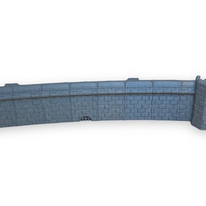 May include: A gray stone wall with a corner tower. The wall is made of small, rectangular stones and has a slightly curved shape. The tower is square and has a small, pointed roof.