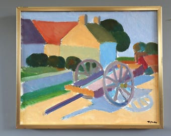 May include: An original oil painting in a gold frame depicts a rural scene. The artwork features colorful houses with red, yellow, and blue hues, a cart with large wheels, and green foliage. The painting has a naive art style.