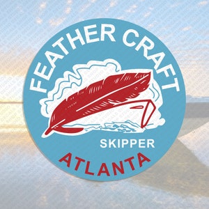 May include: A blue and white circular logo with the text "FEATHER CRAFT" in white lettering. The logo also includes a red feather, the text "SKIPPER", and the text "ATLANTA".