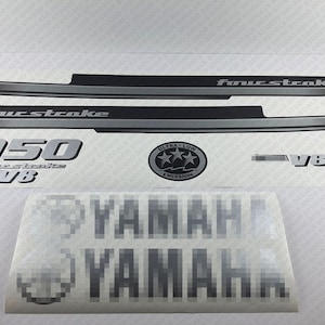 May include: Yamaha outboard motor decal with the text "four stroke" and "350 four stroke V8" and a silver "Ultra Low Emission" sticker with three stars.