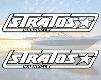 May include: Two white vinyl decals with black outlines. The decals feature the word "STRATOS" in a bold, stylized font with a star to the right. The word "NASHVILLE" appears below the word "STRATOS".