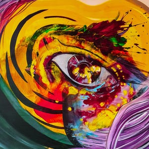 May include: Abstract painting of a single eye with a swirling yellow, purple, and black background. The eye is surrounded by splashes of red, green, and blue paint.