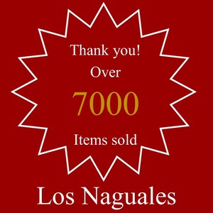 May include: A red starburst with white outline, with the text "Thank you! Over 7000 Items sold Los Naguales" in white and gold lettering.