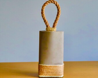Tung betongdörrstopp med rephandtag
