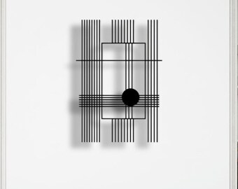 May include: A modern, abstract wall art piece with a black geometric design. The artwork features vertical and horizontal lines, a square, and a black circle. The piece is mounted on a white wall above a blue sofa with white pillows.