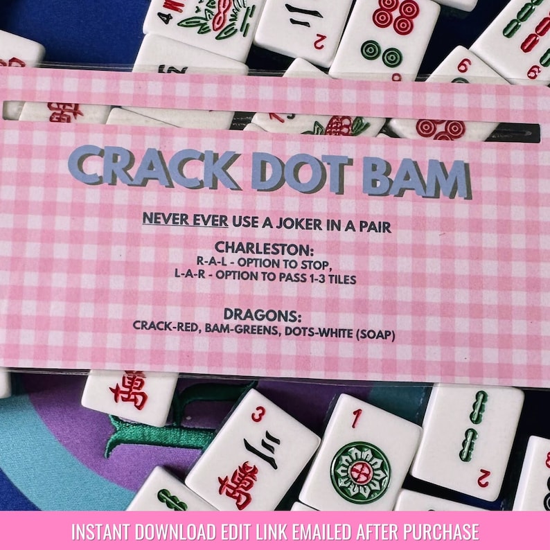May include: A pink and white card with the text "CRACK DOT BAM" in blue. The card has instructions for a game, including the rules for Charleston and Dragons. The card also includes the text "NEVER EVER USE A JOKER IN A PAIR".