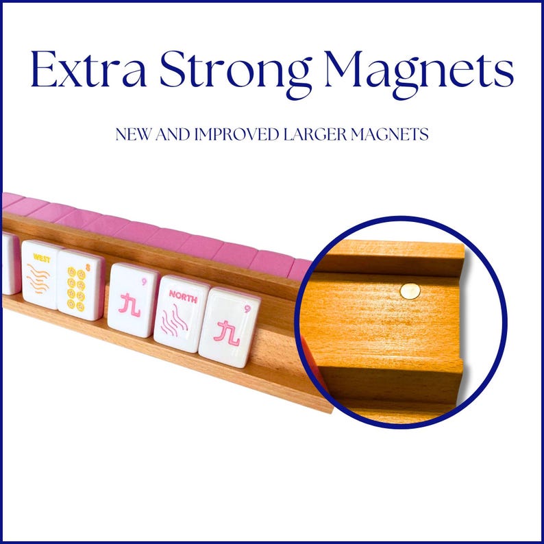 May include: Wooden mahjong tile holder with pink accents and white tiles. The text "Extra Strong Magnets" and "New and Improved Larger Magnets" are displayed. A close-up shows a magnet.