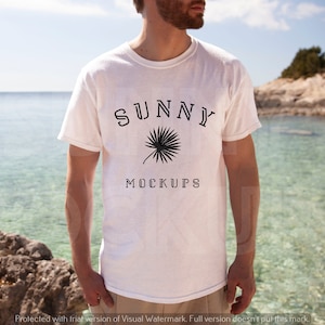 May include: A white t-shirt with a black palm tree graphic and the text "SUNNY MOCKUPS" printed on the front.