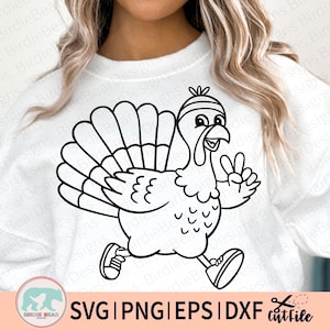 May include: Black and white cartoon turkey running and giving a peace sign. The turkey is wearing a headband and sneakers. The image includes the text "SVG | PNG | EPS | DXF cutfile" and a logo.
