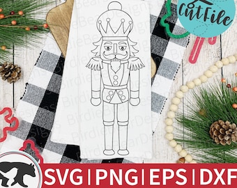 May include: A black and white line art illustration of a nutcracker. The nutcracker is wearing a crown, a beard, and a mustache. The nutcracker is holding a staff in its right hand. The image is on a white background.