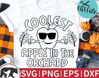 May include: Black and white digital design featuring a cartoon apple wearing sunglasses and giving a thumbs up. The text "Coolest Apple in the Orchard" is written in a bold, outlined font. The design is suitable for use on t-shirts, mugs, and other merchandise.