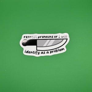 May include: A white sticker with black text that reads "respect pronouns or I will identify as a problem". A cartoon knife is pictured above the text.