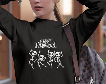 May include: Black sweatshirt with a white graphic of four skeletons dancing and the text "Happy Halloween".
