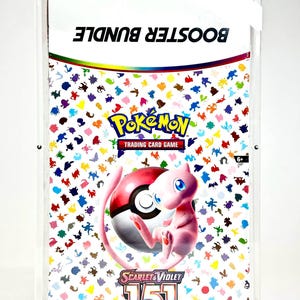 May include: A Pokemon Trading Card Game booster bundle in a clear display case. The bundle features a colorful pattern of Pokemon characters and the text "BOOSTER BUNDLE". The image includes a pink Mew character and a Poke Ball.