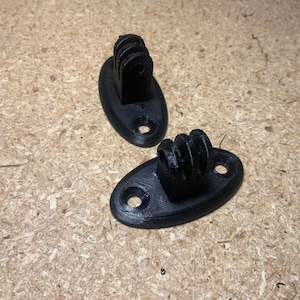 May include: Two black plastic GoPro mounts with a circular base and a three-pronged mount.