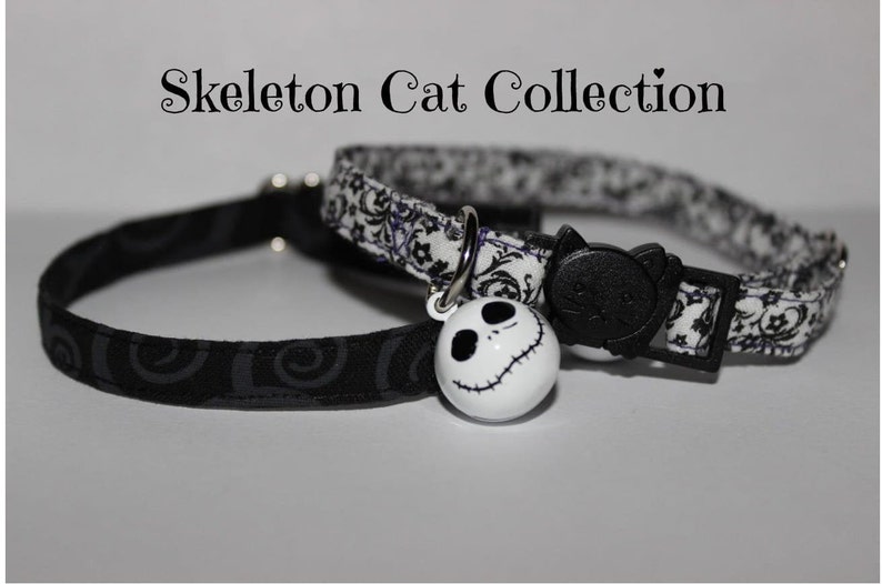 May include: Two cat collars with a black and white patterned design. One collar has a black cat charm and the other has a white Jack Skellington charm. The collars are labeled "Skeleton Cat Collection".